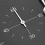 Close-up of a black analog watch face with the second and minute hands, featuring 15, 30, 45, and 60 on the dial—an elegant detail from the Zenith El Primero Limited Edition For Hodinkee by Zenith.