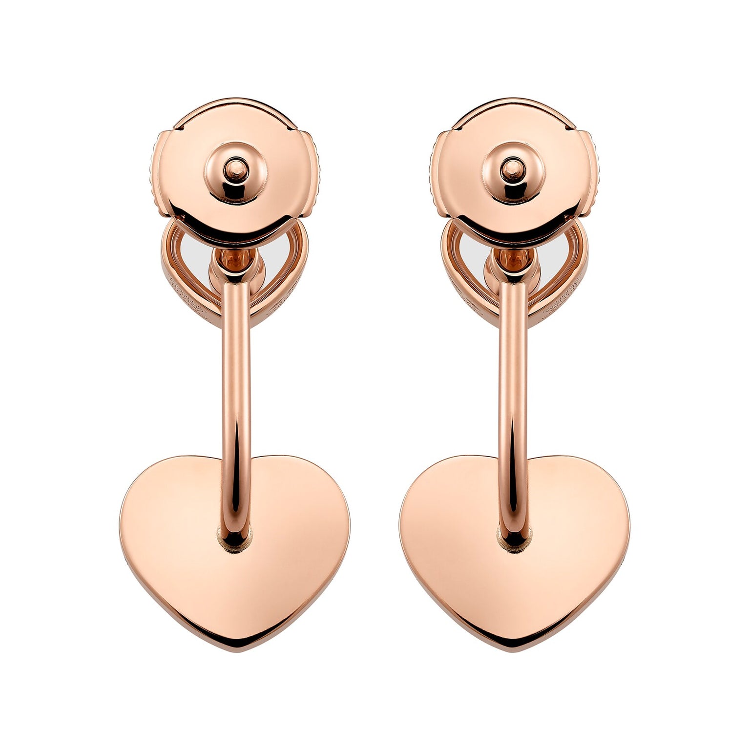 A pair of rose gold clip-on earrings from Chopard’s Happy Diamonds collection, featuring heart-shaped pendants hanging from curved bars.