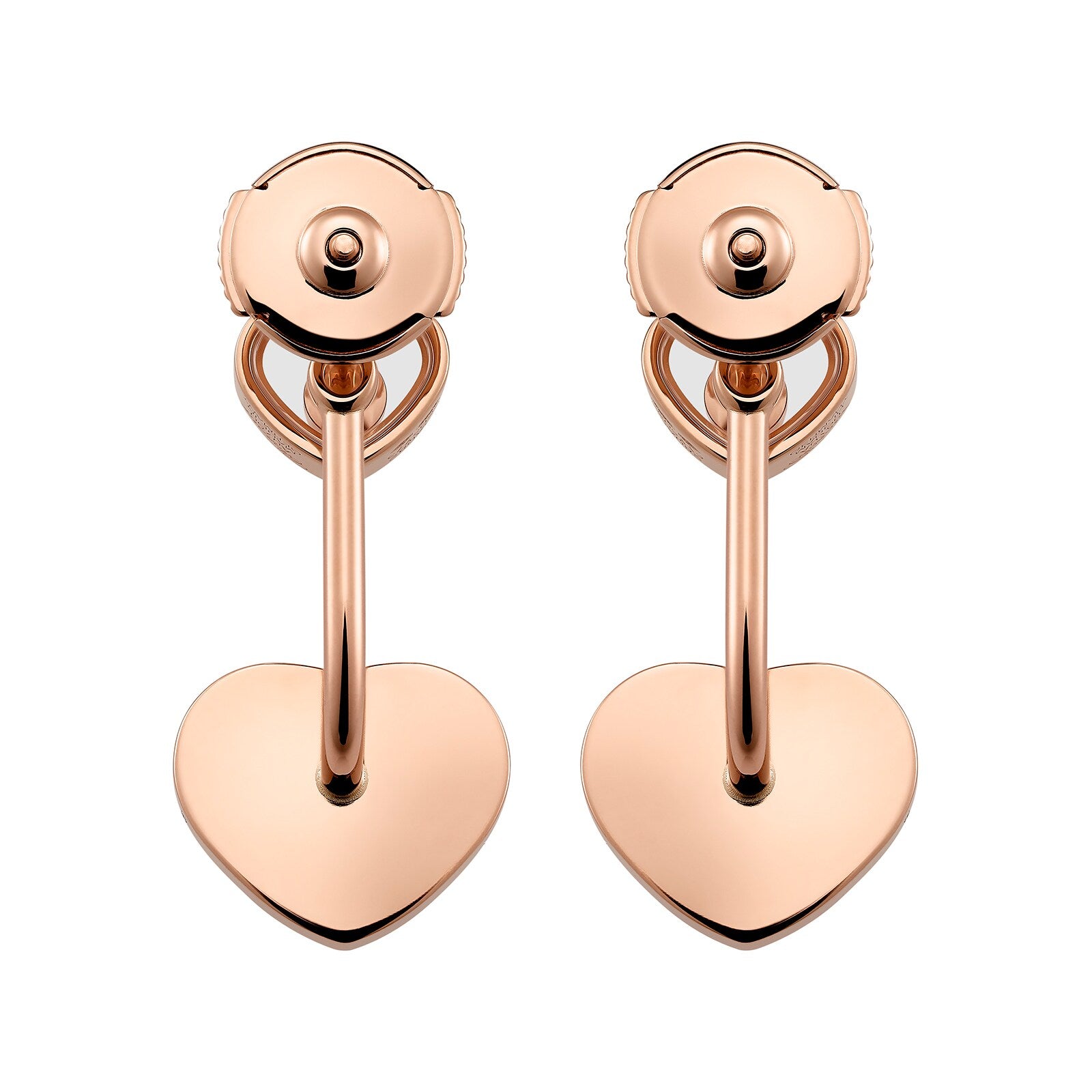 A pair of rose gold clip-on earrings from Chopard’s Happy Diamonds collection, featuring heart-shaped pendants hanging from curved bars.