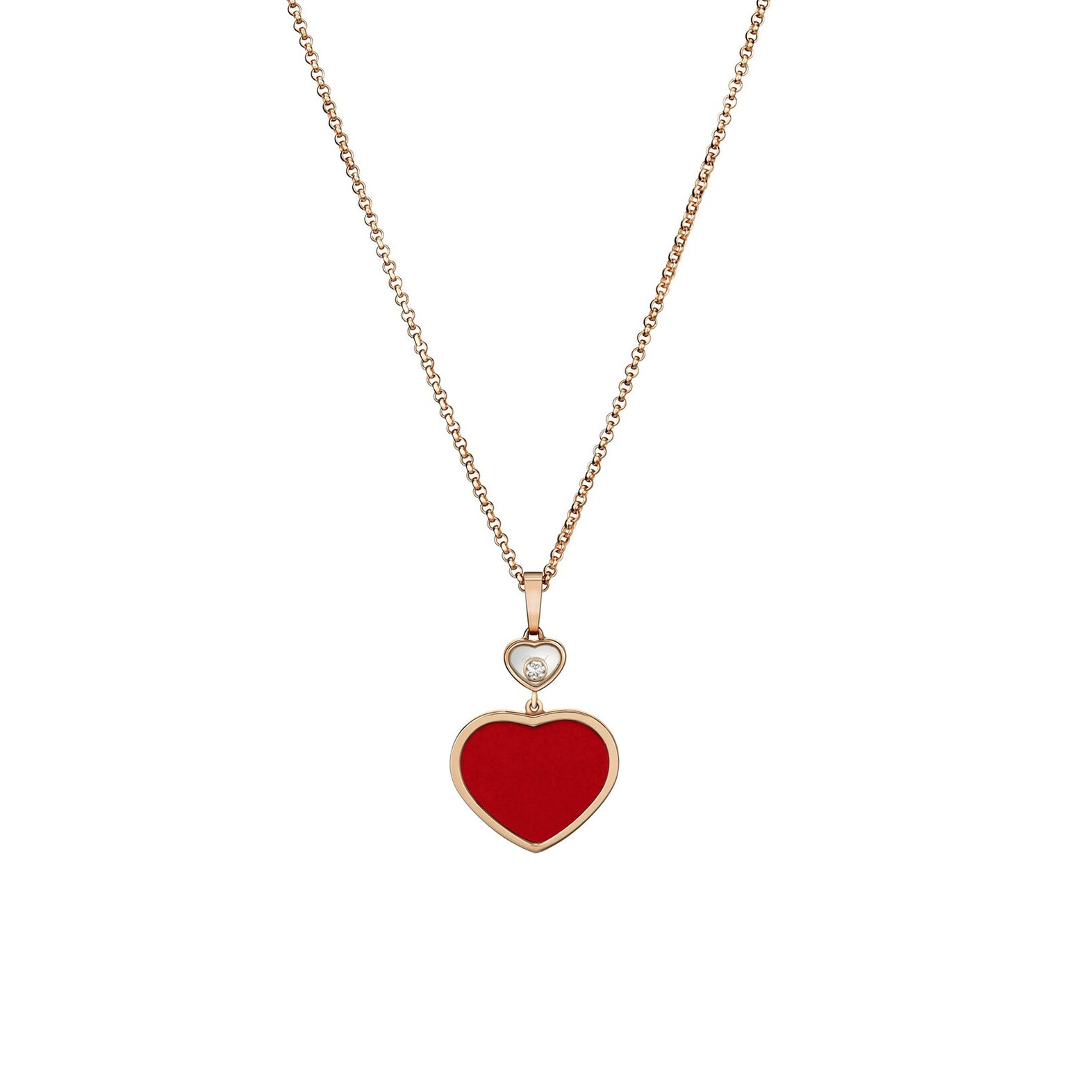 The Chopard Happy Hearts necklace features a red heart-shaped pendant in 18ct rose gold with a floating diamond above the heart.
