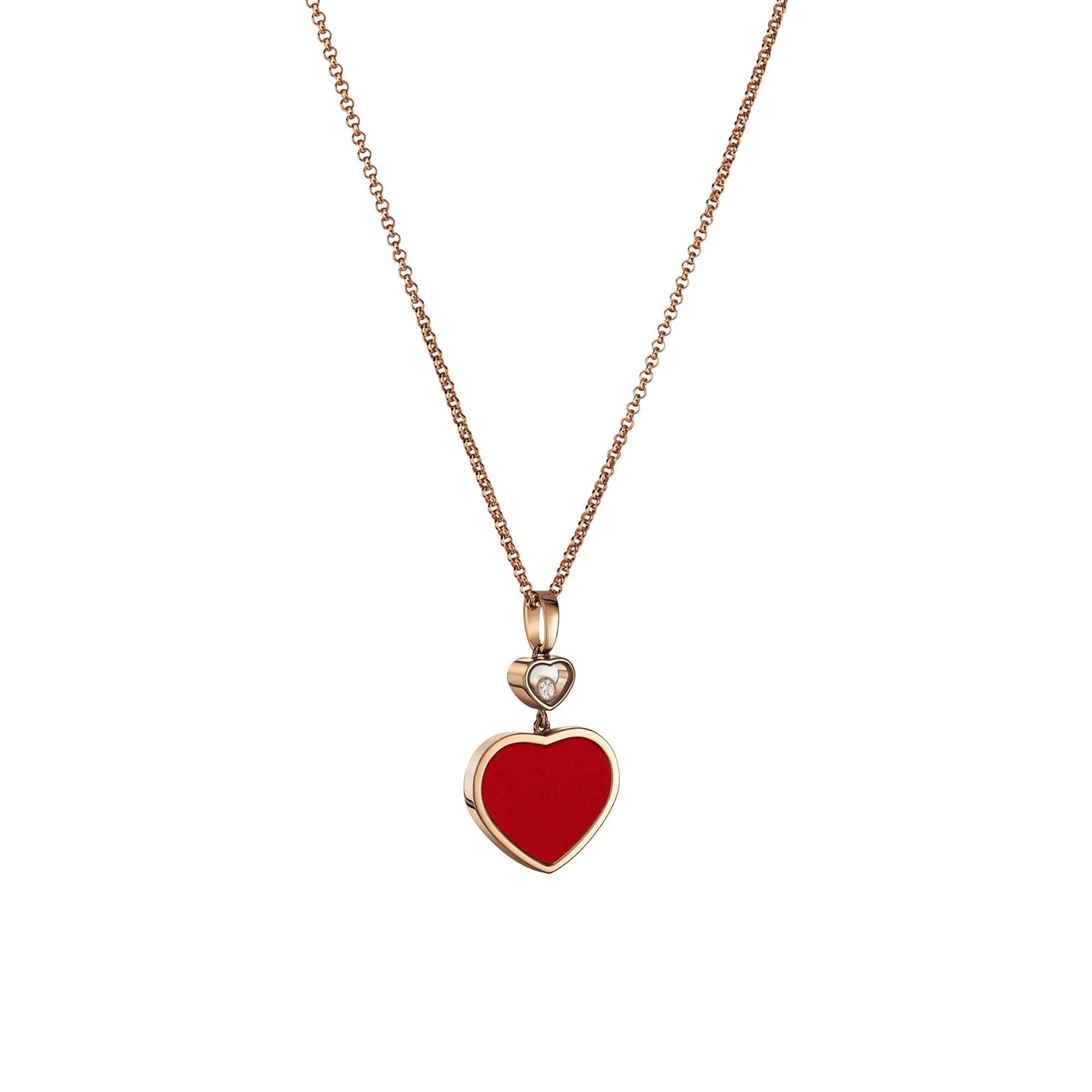 The Chopard Happy Hearts necklace in 18ct rose gold showcases a red heart-shaped pendant with a floating diamond and a delicate heart outline above, elegantly set against a white background.