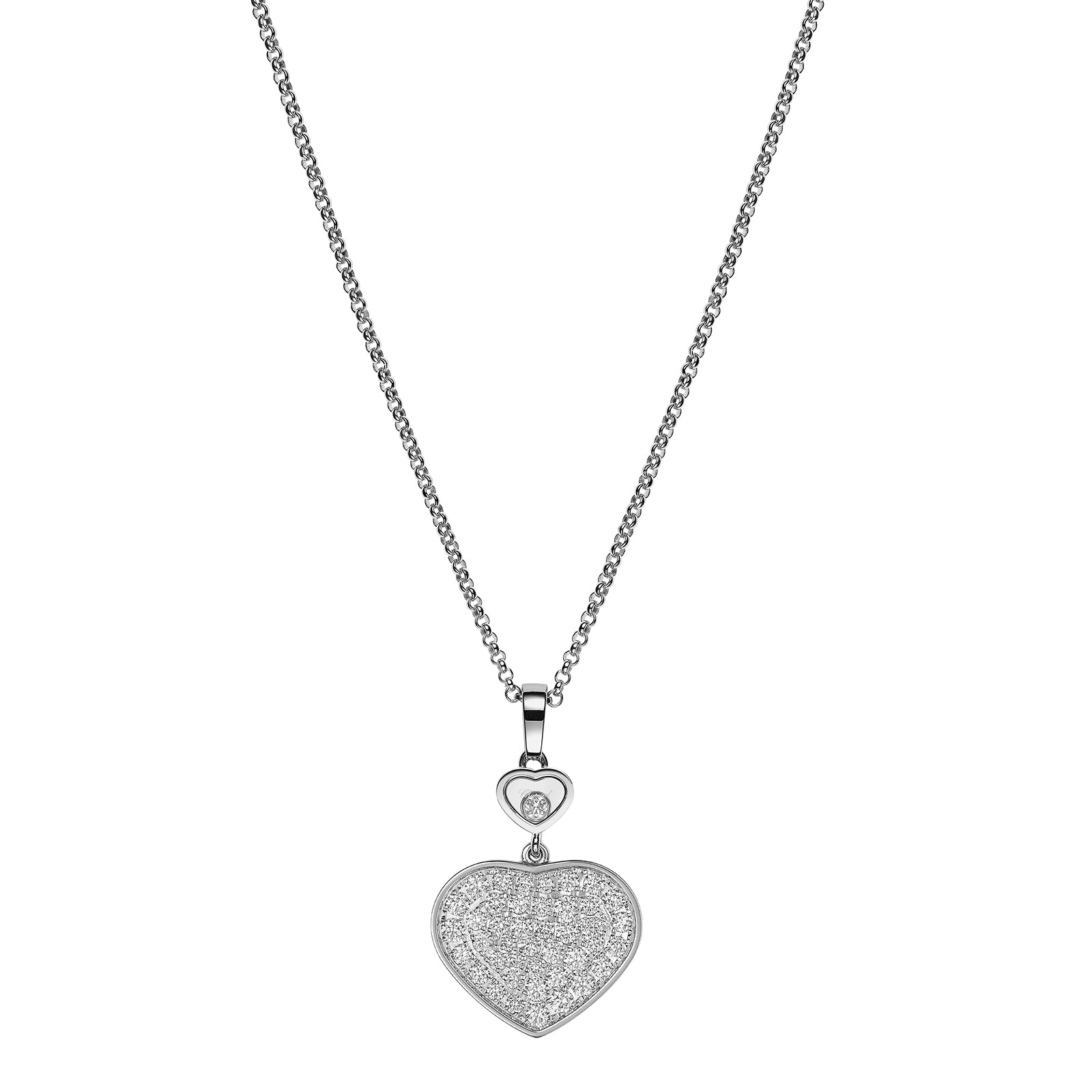 The Chopard Happy Diamonds Planet necklace features a chain with a heart-shaped pendant embellished with small crystals, inspired by the Happy Hearts Collection, and includes playful moving diamonds and a smaller heart accent above the main charm.