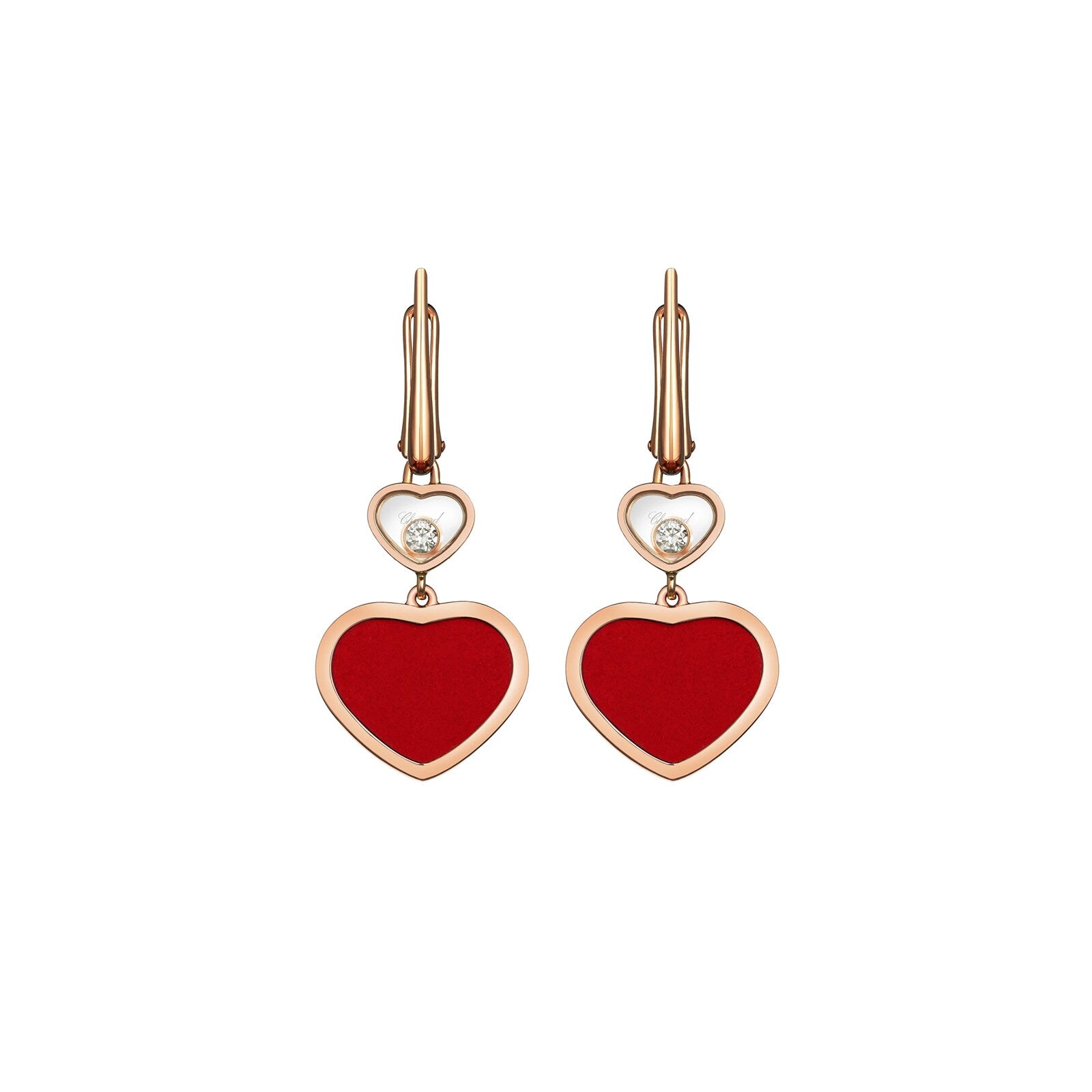 A pair of Chopard Happy Hearts gold dangle earrings with red heart-shaped pendants, small white heart accents, and central dancing diamonds.