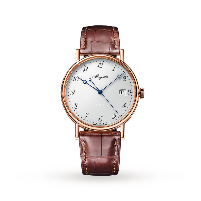 A round gold Breguet Classique 5177 wristwatch with a white dial, blue hands, Arabic numerals, date window at 3 o’clock, and a brown leather strap is displayed on a white background.