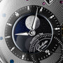 Close-up of a Glashütte Original PanoLunarInverse dial, showcasing horological artistry with a moon phase display, textured patterns, and exquisite craftsmanship.