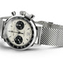 Hamilton American Classic Intra-Matic Auto Chrono wristwatch with a panda dial, two black subdials, tachymeter scale, and stainless steel mesh bracelet, elegantly displayed at an angle.