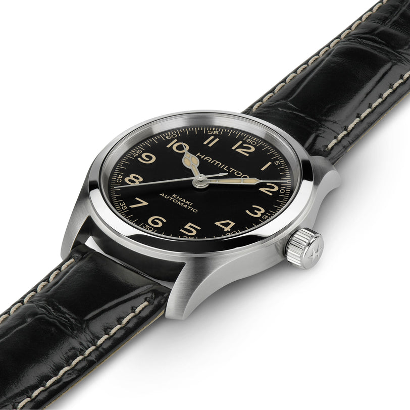 The Hamilton Khaki Field Murph 38mm watch features a black dial with white numerals, a silver case, and a black leather strap with white stitching, plus an 80-hour power reserve and reliable automatic movement.