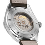Close-up of the Hamilton Khaki Field Expedition Auto wristwatch, highlighting its automatic movement visible through a transparent case back and elegant stainless steel case.