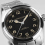Close-up of the Hamilton Khaki Field Murph 38mm, featuring a black dial, luminous hands, Arabic numerals, and a stainless steel bracelet—a modern interpretation of this classic timepiece.