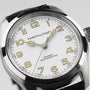 Close-up of the Hamilton Khaki Field Murph 38mm, featuring a white textured dial, gold-tone numerals and hands, and a black leather strap—a must-have vintage-inspired piece for Hamilton fans.