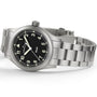 The Hamilton Khaki Field Quartz 38mm watch features a silver case, black dial with white numerals, and a metal bracelet.