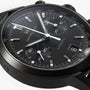 Close-up of a Hamilton American Classic Intra-Matic Auto Chrono, a black automatic chronograph watch featuring a date display set to the 8th.