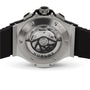 Close-up of the Hublot Big Bang Original Steel watch’s back, showcasing its chronograph movement through a transparent case back with engraved branding and a black rubber strap, underscoring its sporty design.