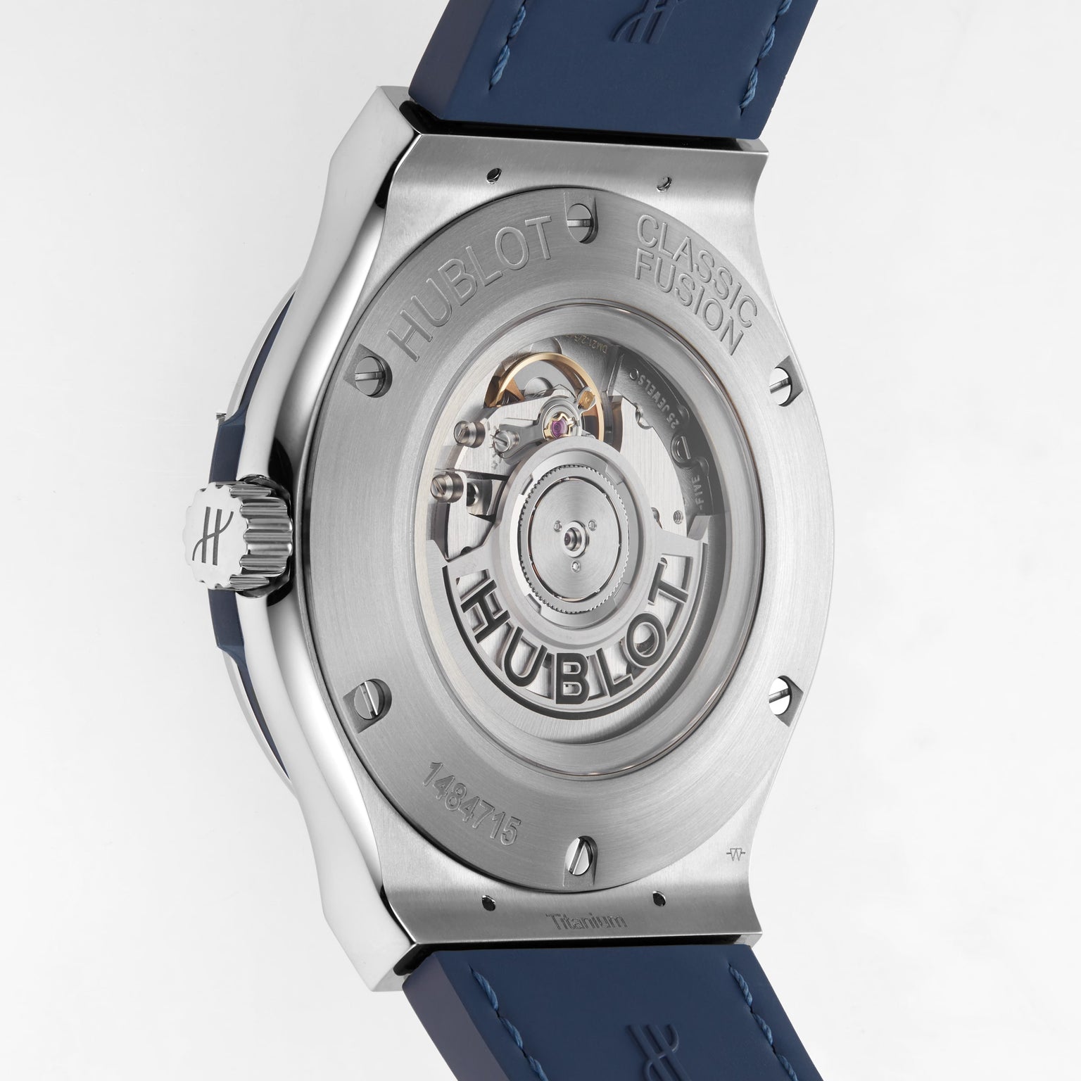 Close-up of the Hublot Classic Fusion Titanium Blue watch back, showcasing its automatic movement through a transparent case back and finely engraved branding on the titanium case.