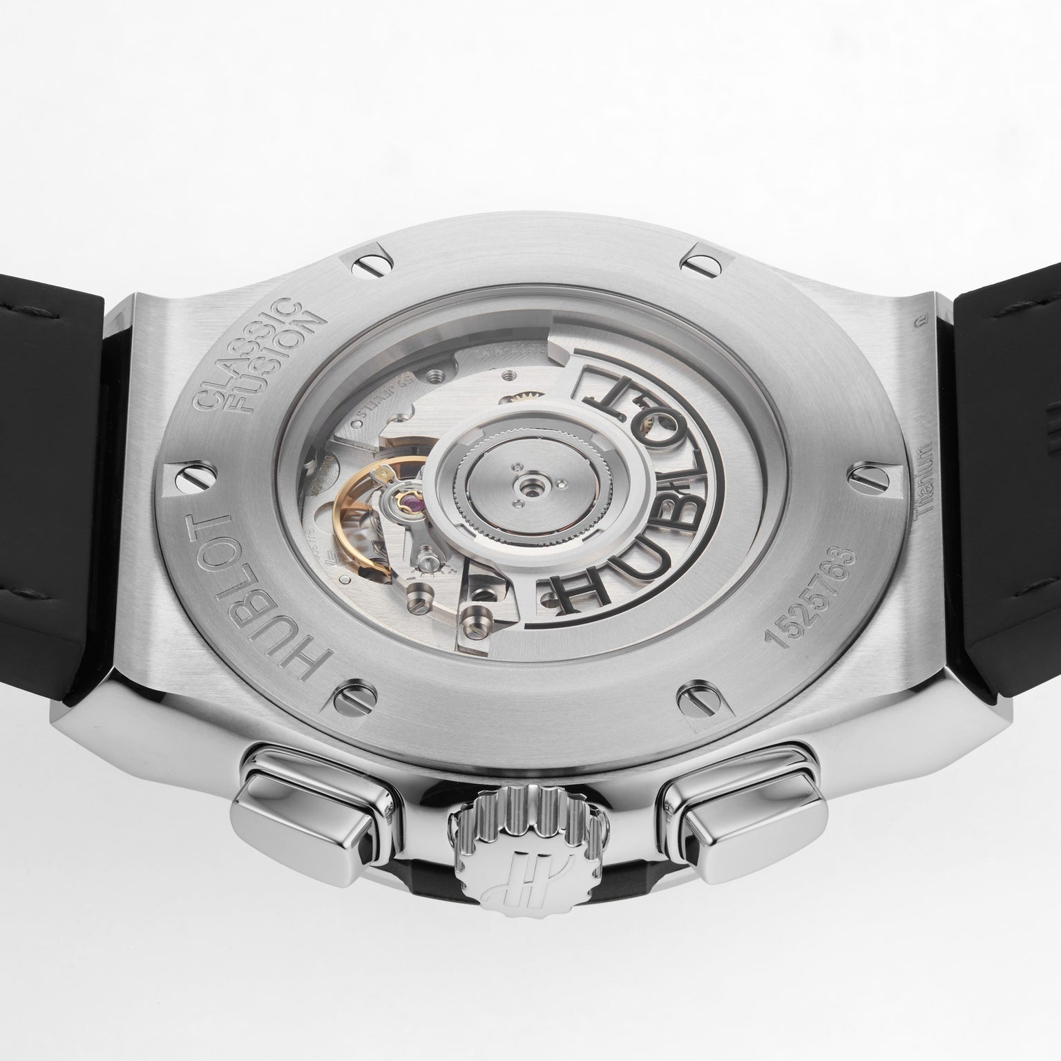 Close-up of the back of a Hublot Classic Fusion Chronograph Titanium watch, revealing its mechanical movement through a transparent case back.