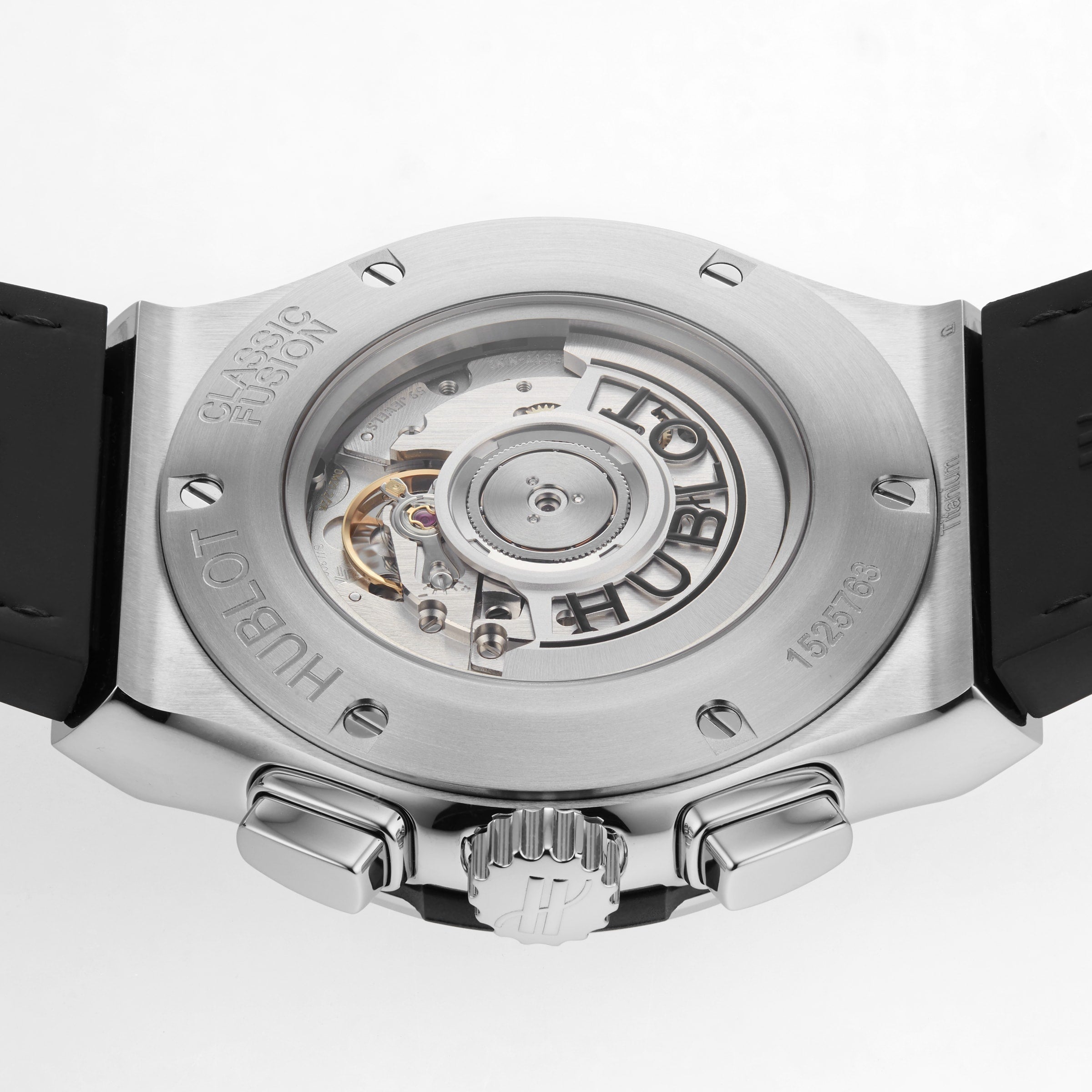 Close-up of the back of a Hublot Classic Fusion Chronograph Titanium watch, revealing its mechanical movement through a transparent case back.