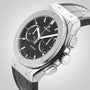 A Hublot Classic Fusion Chronograph Titanium wristwatch featuring a black dial, silver titanium case, and black leather strap displayed on a light background.