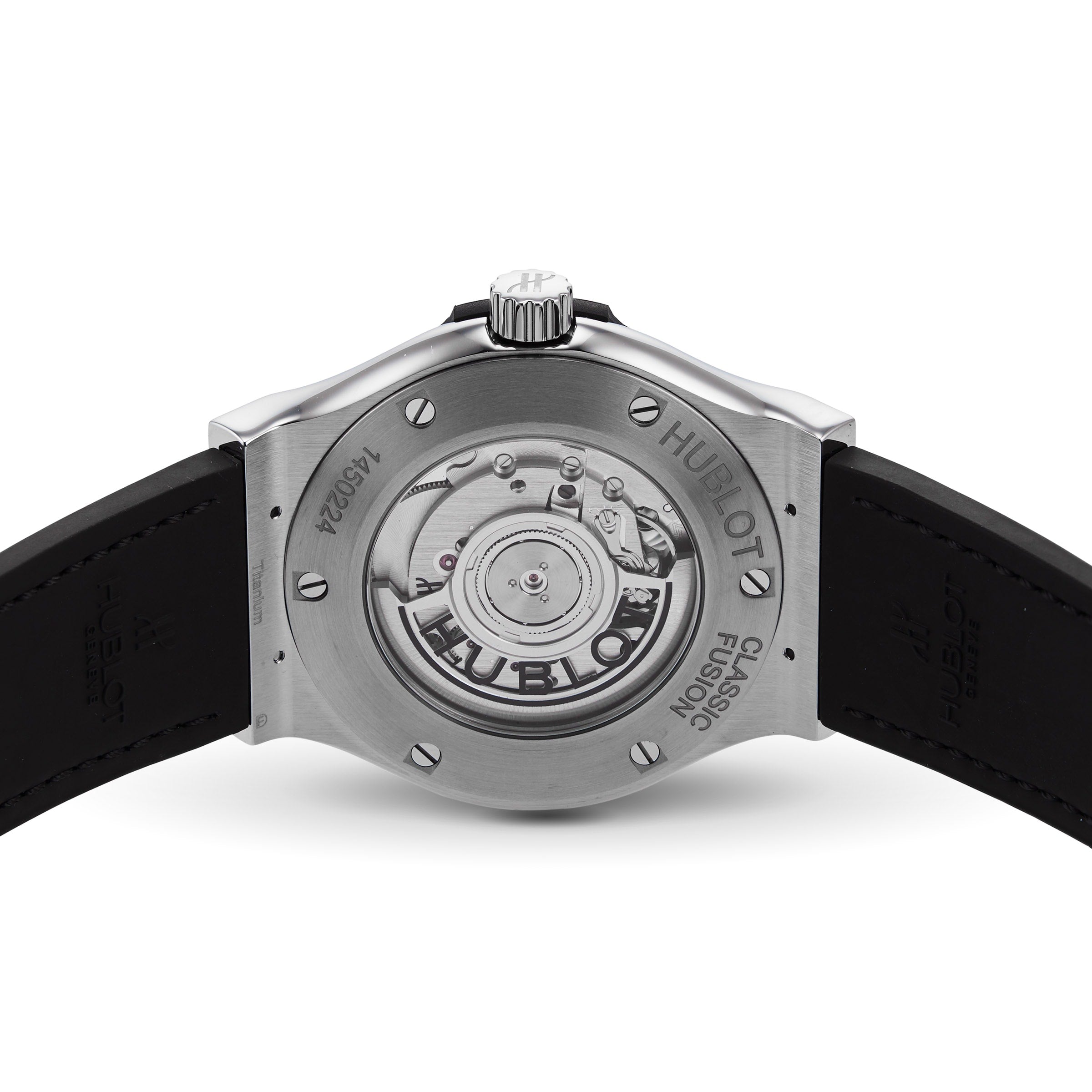 A close-up of the Hublot Classic Fusion Titanium watch highlights its titanium case and showcases the exposed automatic movement visible through the transparent case back.