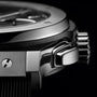 Close-up of the Hublot Classic Fusion Chronograph Titanium, highlighting its polished titanium case, crown, and pushers, with part of the self-winding chronograph dial and strap in view.