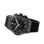 The Hublot Classic Fusion Chronograph Black Magic features a black ceramic case, black rubber strap, silver hour markers, and three subdials. Shown angled left and powered by the HUB1143 self-winding chronograph movement.