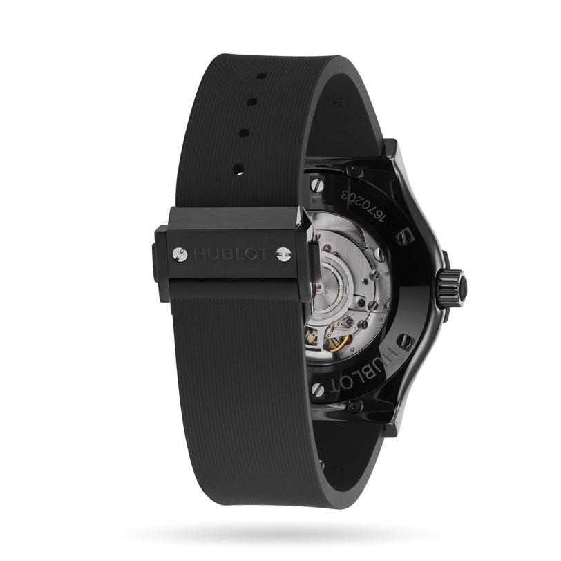 Back view of a Hublot Classic Fusion Black Magic wristwatch featuring a black rubber strap, black ceramic case, and exposed automatic movement visible through the transparent case back.
