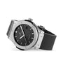 The Hublot Classic Fusion Racing Grey Titanium features a titanium case, grey dial, silver hour markers, date display, and a black rubber strap with self-winding movement.