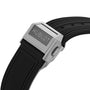 Close-up of the Hublot Spirit Of Big Bang Titanium Ceramic watch clasp, engraved with the brand, attached to a black ribbed rubber strap and featuring a black ceramic and titanium case.
