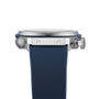 Side view of the Hublot Classic Fusion Chronograph Titanium Blue wristwatch, showcasing its titanium case, blue textured strap, and visible crown and pusher.