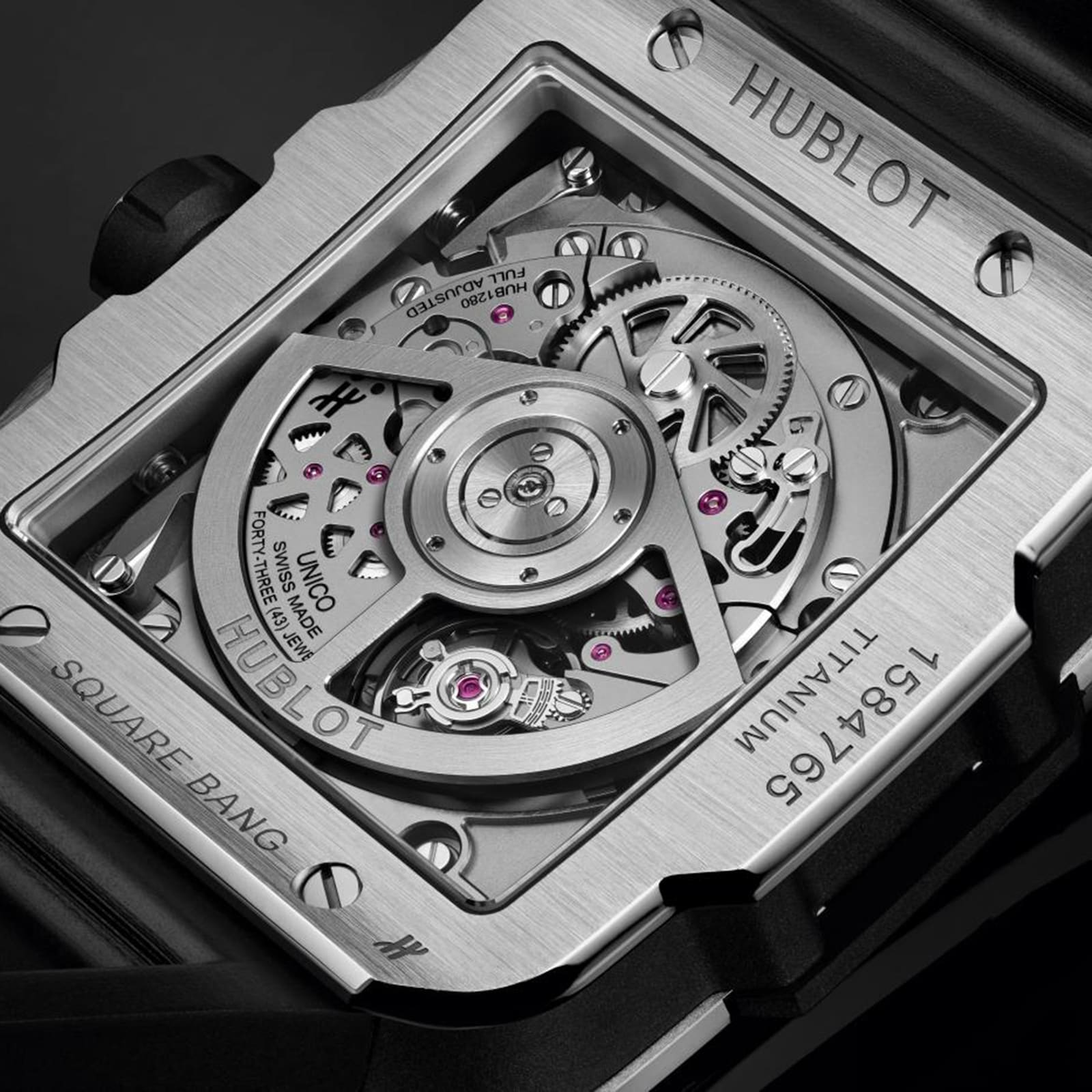 Close-up of the Hublot Square Bang Unico Titanium caseback, highlighting the detailed Unico movement and engraved specifications on its durable titanium case.