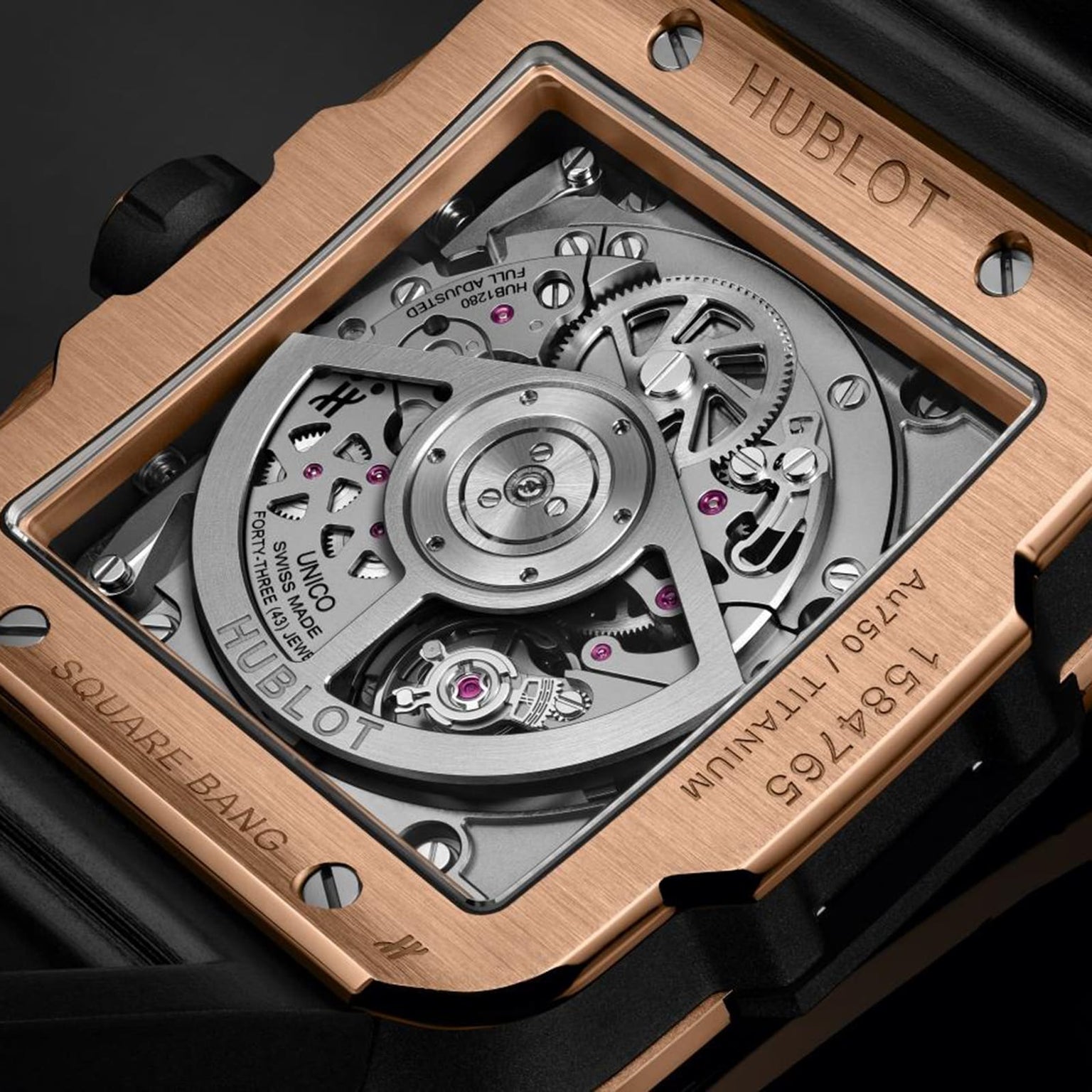 Close-up of the Hublot Square Bang Unico King Gold Ceramic’s back, showcasing its transparent case, intricate HUB1280 UNICO movement, and detailed engravings on an 18K King gold and black ceramic frame.