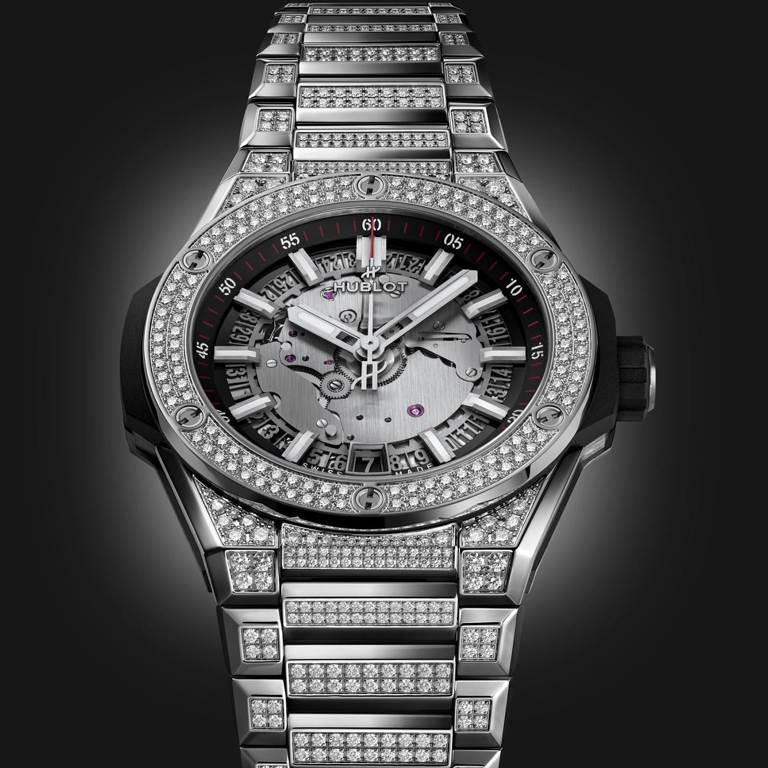 The Hublot Big Bang Integrated Time Only Titanium Pavé is a luxury watch with a titanium case and metal band set with diamonds, plus a partially skeletonized dial and visible gears, inspired by the Big Bang Integrated Time collection.