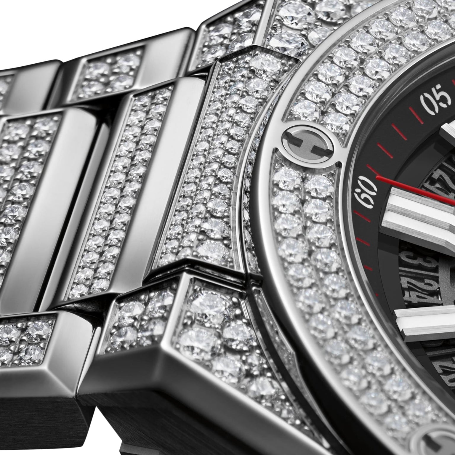Close-up of the Hublot Big Bang Integrated Time Only Titanium Pavé, a luxury wristwatch with a titanium case, metal band, and diamond-encrusted bezel and bracelet—an exquisite piece from Hublot.