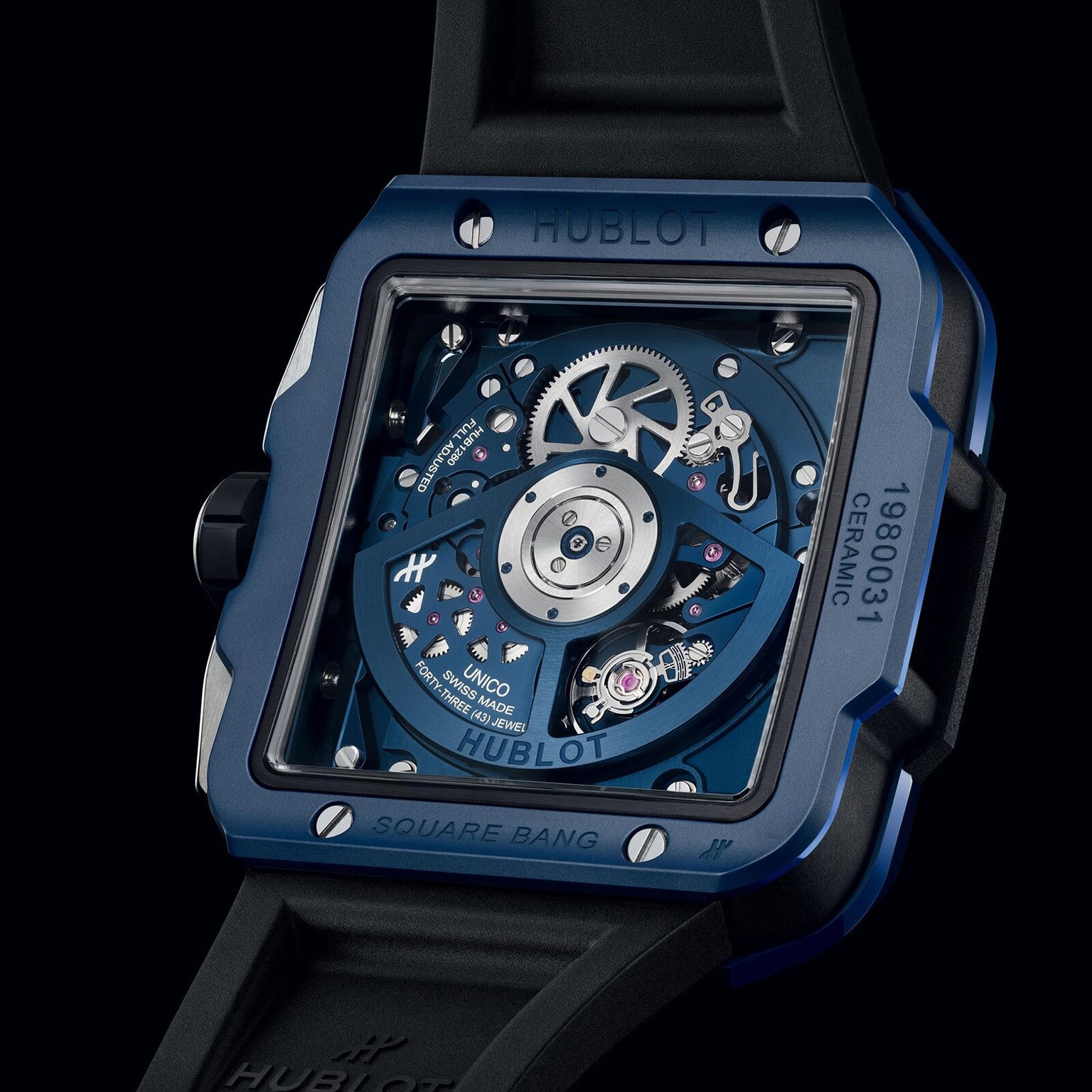 A close-up of the Hublot Square Bang Unico Blue Ceramic watch’s back displays its exposed HUB1280 UNICO mechanical movement and detailed gears beneath a sapphire crystal dial.
