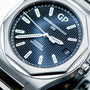 Close-up of the Girard-Perregaux Laureato 42, showcasing its black textured dial, silver hands and markers, date window at 3 oclock, and octagonal bezel on a 42mm stainless steel case.