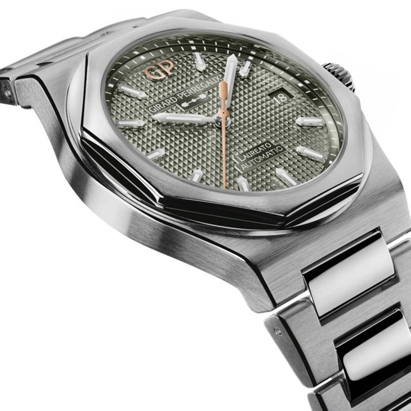 Girard-Perregaux Laureato 38 watch featuring a silver stainless steel bracelet and a green textured dial.