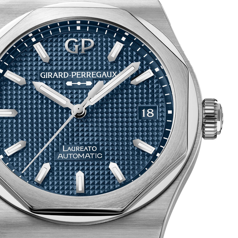 Close-up of a Girard-Perregaux Laureato 38 watch featuring a blue textured dial and silver hands.
