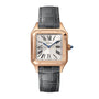 The Cartier Santos-Dumont features an 18K rose gold square case, white dial with black Roman numerals and blue hands, complemented by a dark gray leather strap.