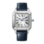 The Cartier Santos-Dumont watch features a square silver dial with Roman numerals, blue hands, and a black leather strap, powered by precise mechanical movement.