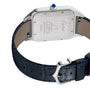 Back view of the Cartier Santos-Dumont watch with a stainless steel case, blue crown, tan leather underside, and dark blue alligator strap. Features mechanical movement and engraved logo on the back.