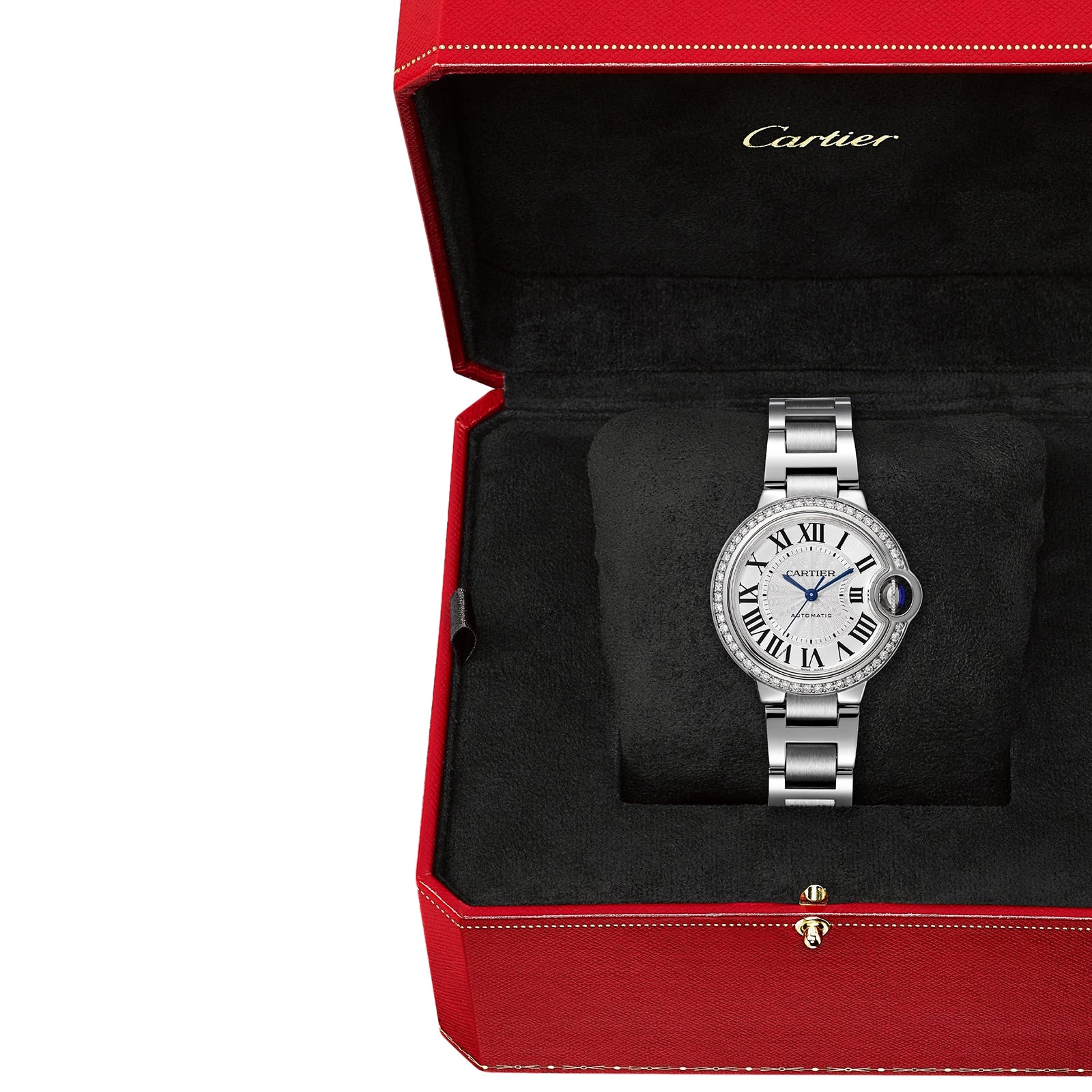 A Ballon Bleu de Cartier wristwatch with a round face and Roman numerals sits in an open red Cartier box, its elegant steel case highlighted against the black interior.