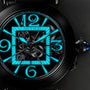 Close-up of a Cartier Pasha de Cartier Skeleton watch featuring a skeleton dial with blue luminous numerals and hands, showcasing its intricate mechanical movement and visible gears.