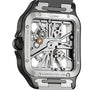 The Santos de Cartier Skeleton wristwatch by Cartier features a square face, skeleton dial with visible gears, and a silver stainless steel case and strap—blending elegance with minimalism.