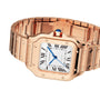 A Cartier Baignoire watch with a rose gold case, white dial, black Roman numerals, blue hands, a blue crown gemstone, and a linked gold bracelet.