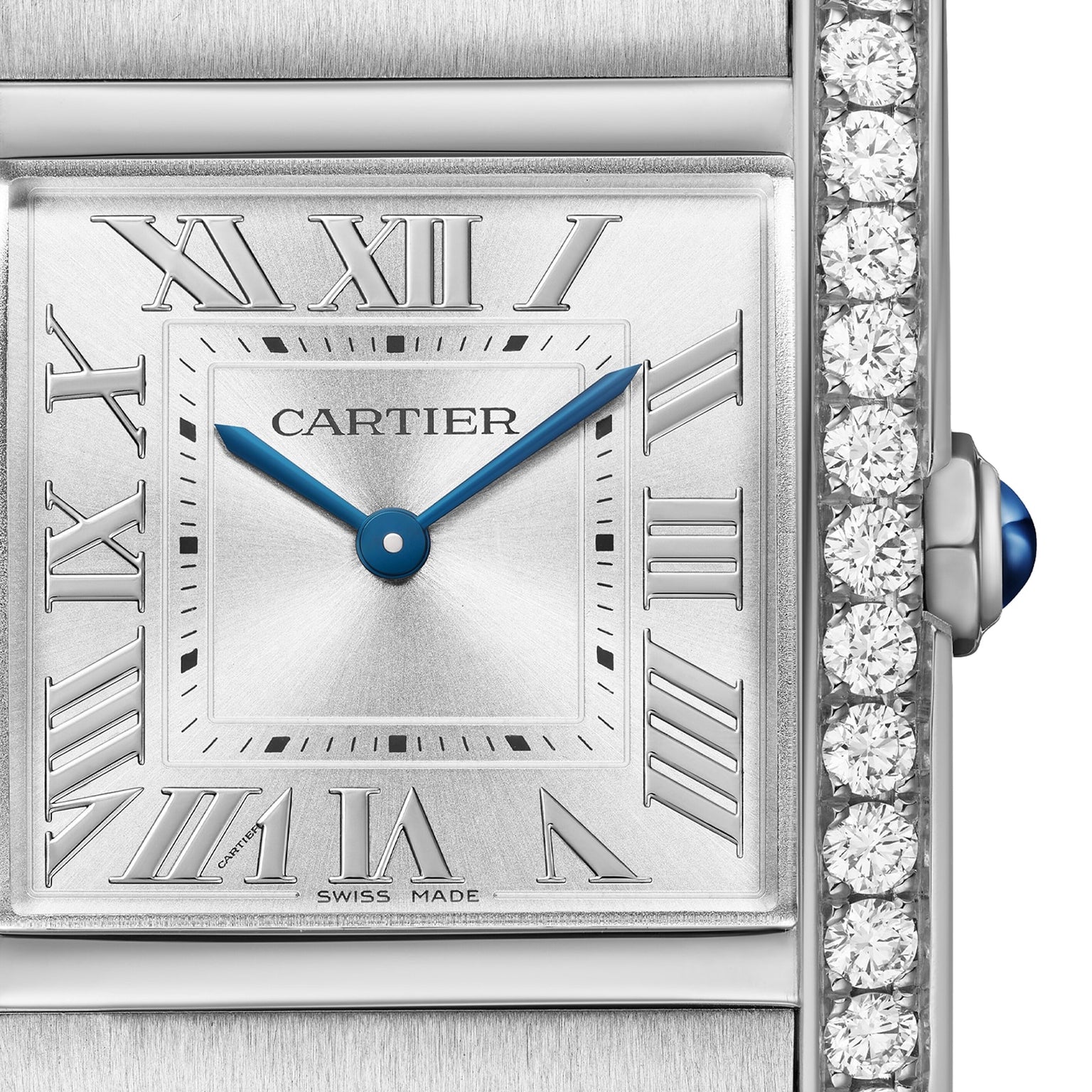 A close-up of the Cartier Tank Française reveals its Roman numerals, blue steel hands, diamond-set bezel, and signature cabochon crown—a timeless icon from Cartier.