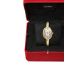 Cartier Baignoire gold wristwatch featuring an oval face with Roman numerals, presented in a signature red Cartier box.