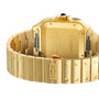 Close-up of the Santos de Cartier watchs 18K yellow gold caseback showing visible screws, engraved details, and the Cartier logo on the bracelet clasp, which features the SmartLink adjustment system.
