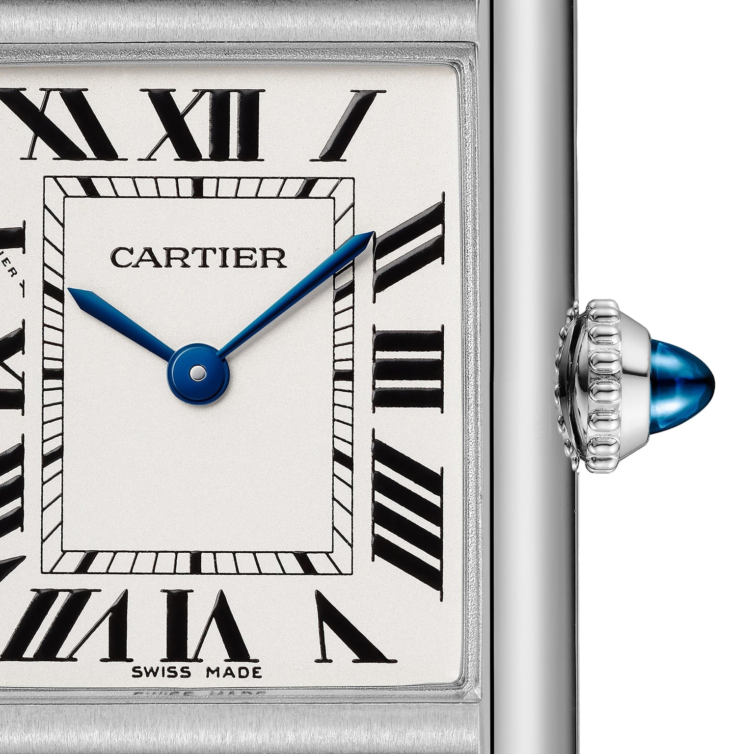 Close-up of the Cartier Tank Must de Cartier watch face with Roman numerals, blue steel hands, and a silver beaded crown set with a blue cabochon, featuring precise quartz movement.