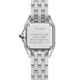 Back view of the Panthère de Cartier Small Model, a stainless steel watch by Cartier, with engraved brand name, material, country of origin, water resistance, serial number, and a visible blue cabochon crown.