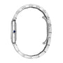 Side view of the Cartier Tank Must Solarbeat™ in silver steel with a linked bracelet, showcasing its thin profile and blue cabochon crown.