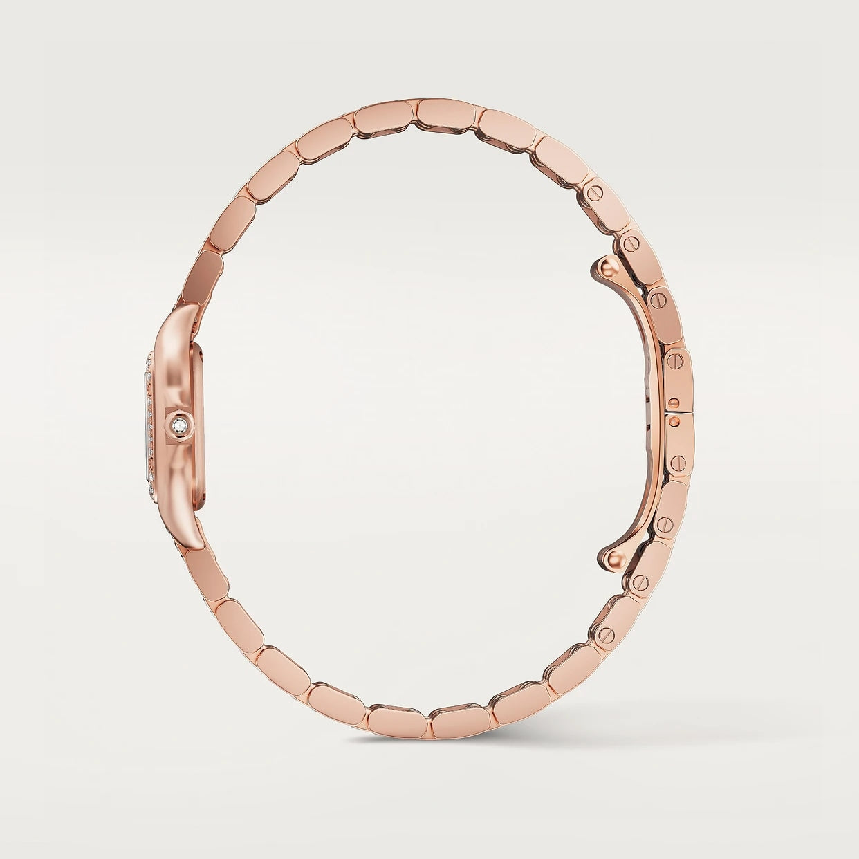 Side view of the thin, elegant Panthère De Cartier Watch by Cartier, featuring a rose gold linked bracelet against a plain white background.